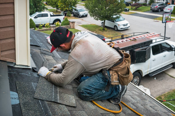 Professional Roofing technician working in Wenham, MA
